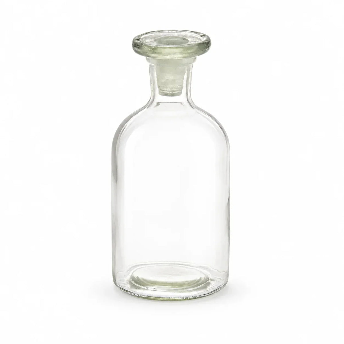 A clear glass bottle with a wide base and a short, flared neck, shown empty on a plain white background.