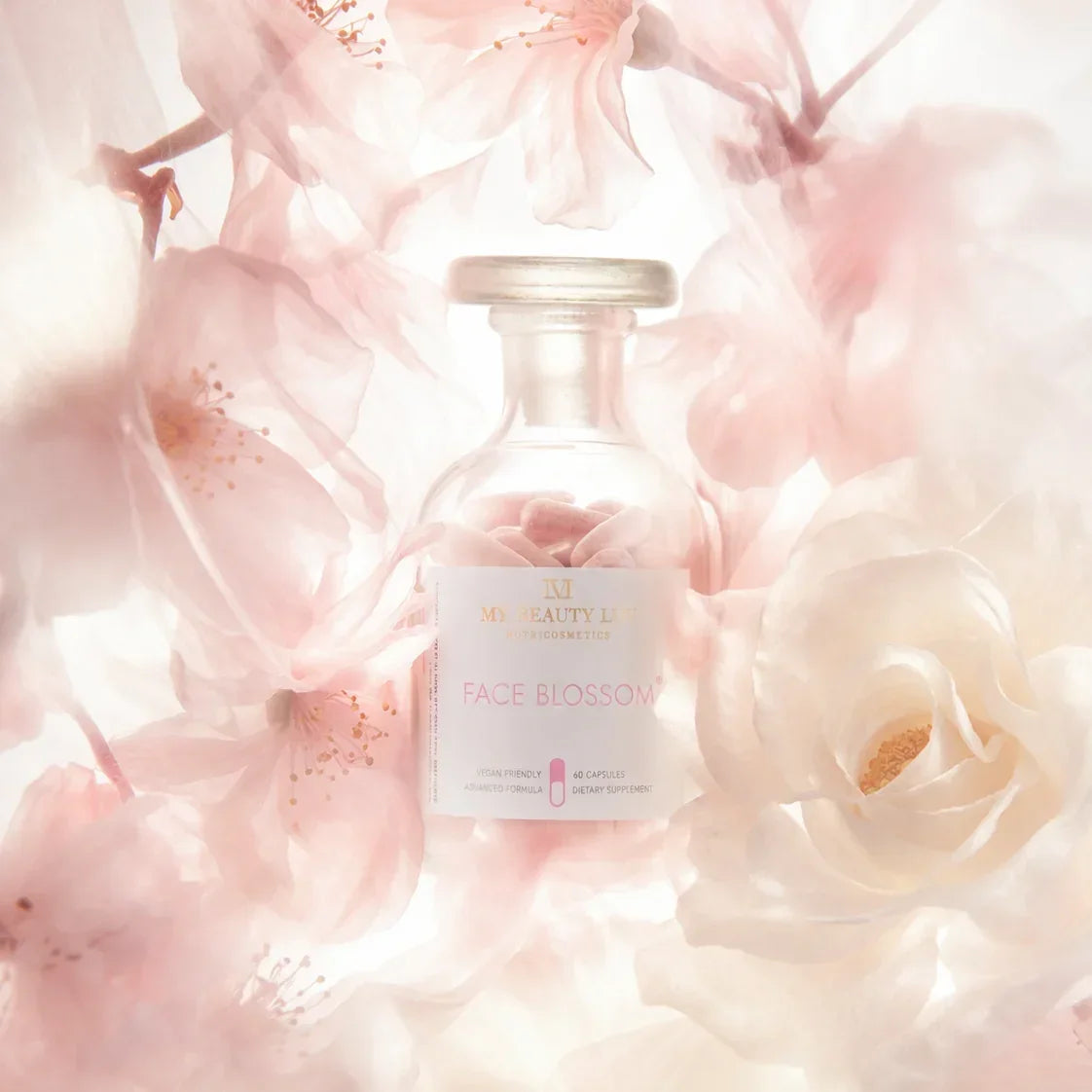 Supplement bottle labeled 'Face Blossom' surrounded by pink flowers