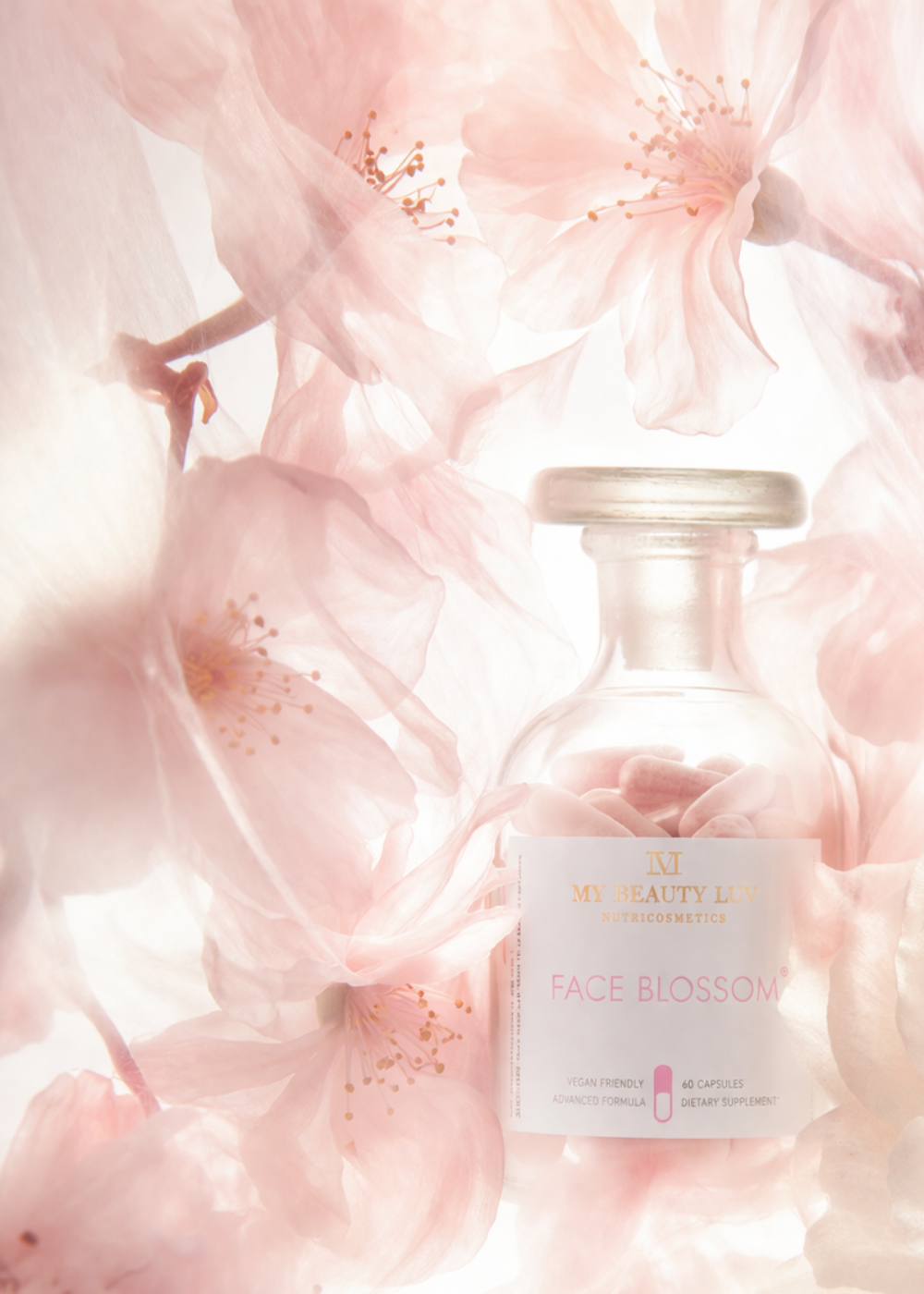 Skincare bottle labeled 'Face Blossom' on a soft pink floral background